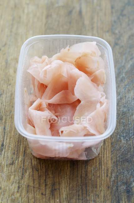Preserved ginger in plastic container — Stock Photo