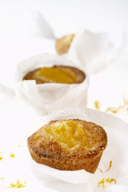 Muffins wrapped in paper — Stock Photo