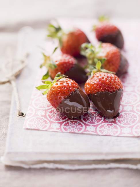 Strawberries dipped in dark chocolate — Stock Photo