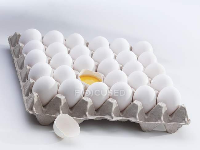 Fresh eggs in an egg tray — Stock Photo