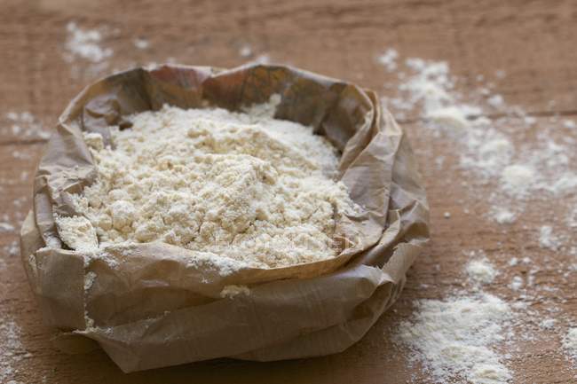 Coconut flour in paper bag — Stock Photo
