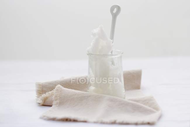 Closeup view of coconut fat in a jar with cloth — Stock Photo