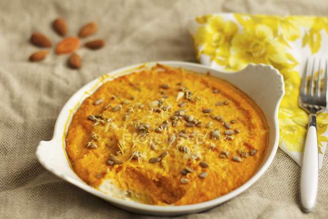 Carrot gratin with seeds — Stock Photo