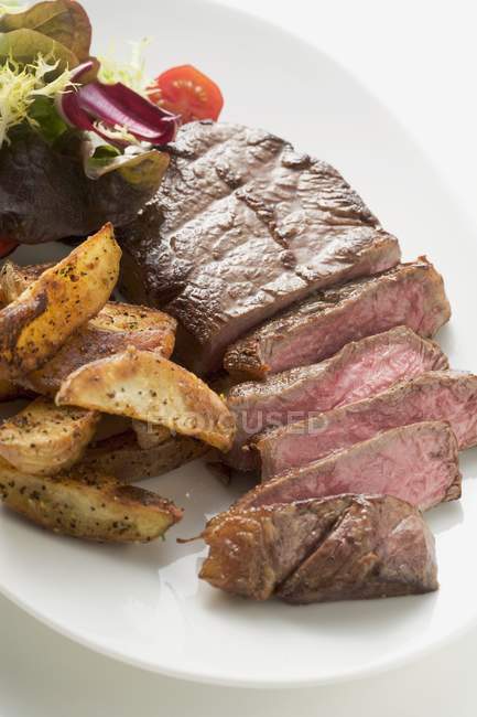 Beef steak with wedges — Stock Photo