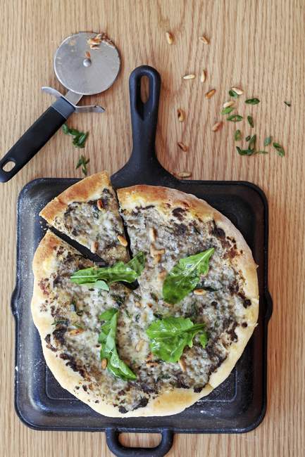 Pizza with mushrooms and pine nuts — Stock Photo