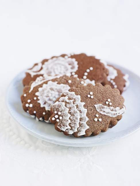 Chocolate biscuits with lace — Stock Photo