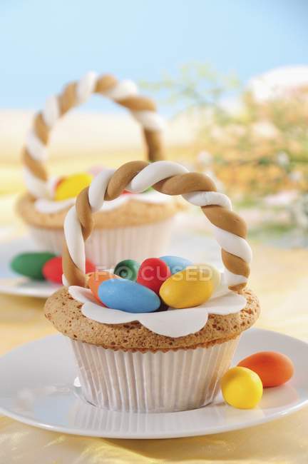 Cupcakes decorated with sugar eggs — Stock Photo