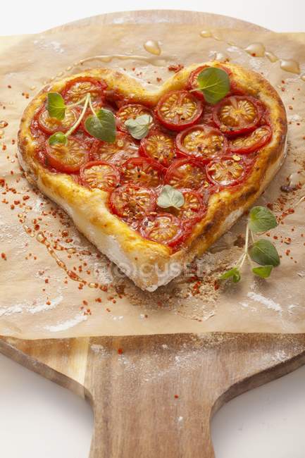Heart-shaped pizza — Stock Photo