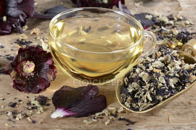 Hollyhocks tea in glass cup — Stock Photo