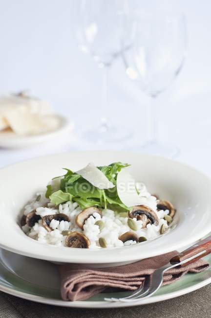 Risotto with mushrooms on plates — Stock Photo