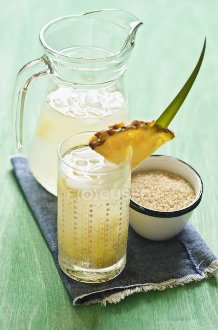 Pineapple drink and cane sugar — Stock Photo