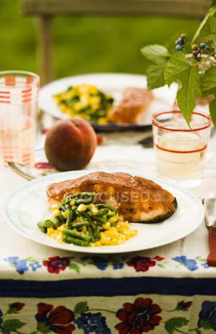 Peach glazed salmon with corn and beans — Stock Photo
