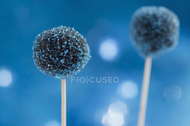 Closeup view of blue cake pops with icing on sticks — Stock Photo