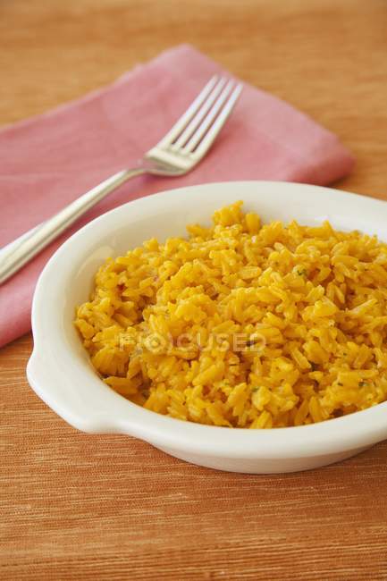 Bowl of yellow rice — Stock Photo