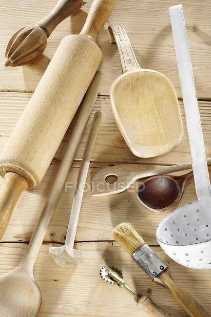 Kitchen utensils on pale — Stock Photo