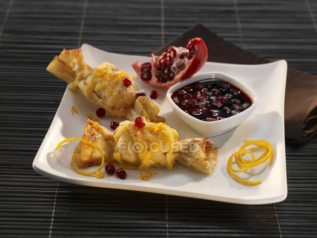 Pastry parcels with pomegranate — Stock Photo