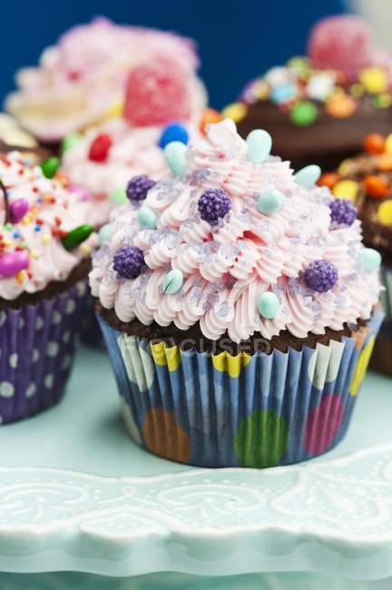 Assortment of ornately decorated cupcakes — Stock Photo