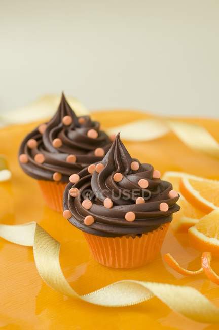 Chocolate cupcakes with sugar confetti — Stock Photo