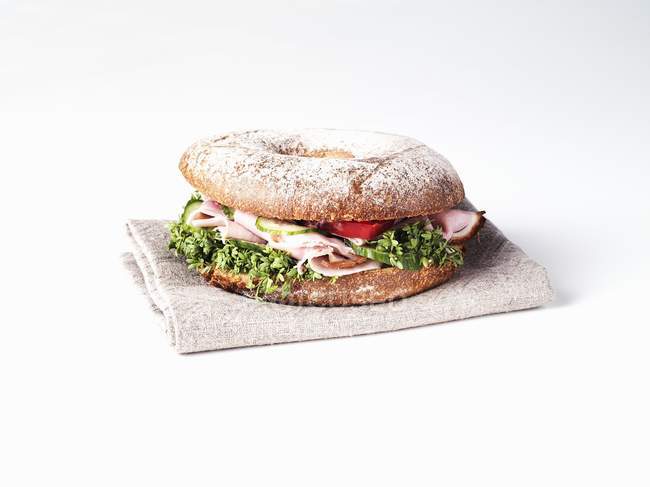 Bagel with ham and cress — Stock Photo