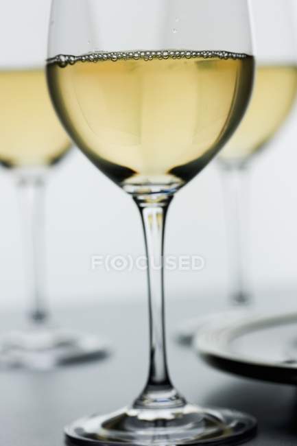 Closeup view of Chardonnay wine in stemmed glasses — Stock Photo