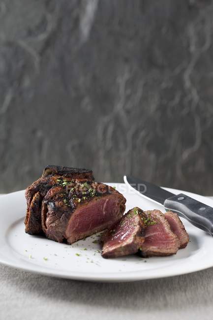 Partially Sliced Steak — Stock Photo