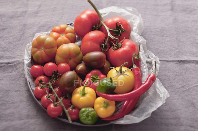 Assortment of tomatoes and chillies — Stock Photo