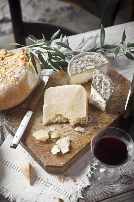 Cheese on a wooden board — Stock Photo