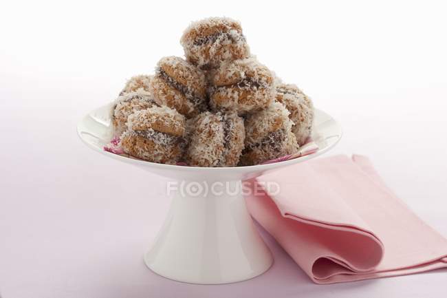 Chocolate macaroons rolled in coconut — Stock Photo