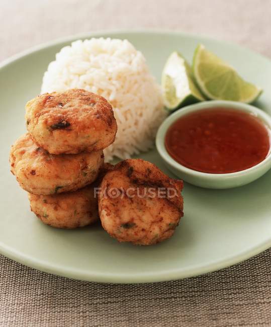 Fishcakes with chilli and rice — Stock Photo