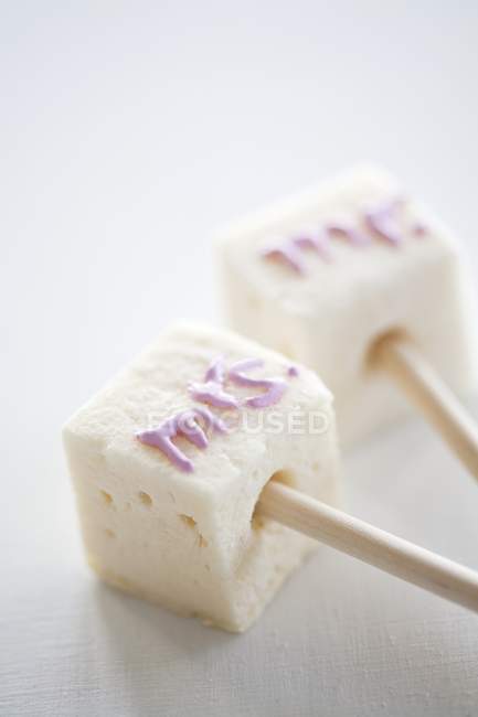 Marshmallows decorated with writing — Stock Photo