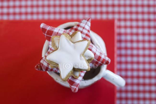 Biscuits and a fabric star — Stock Photo
