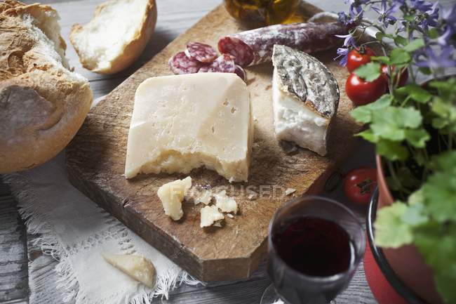 Cheese on wooden board — Stock Photo