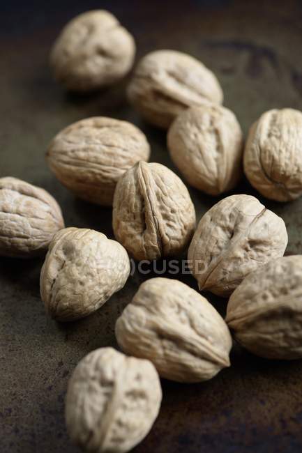 Raw Walnuts with shell — Stock Photo