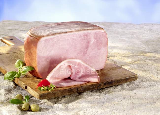 Partly sliced boiled ham — Stock Photo