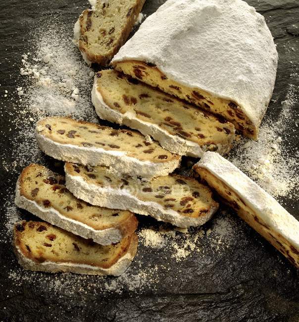 Christmas stollen dusted with icing sugar — Stock Photo