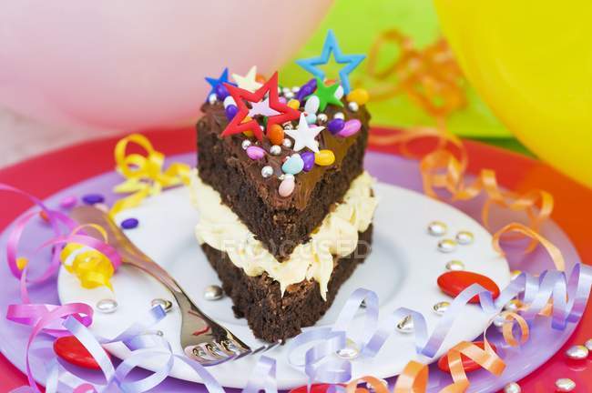 Chocolate cake with colorful sprinkles — Stock Photo
