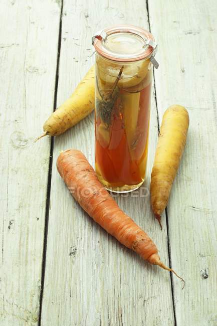 Pickled carrots in jar — Stock Photo