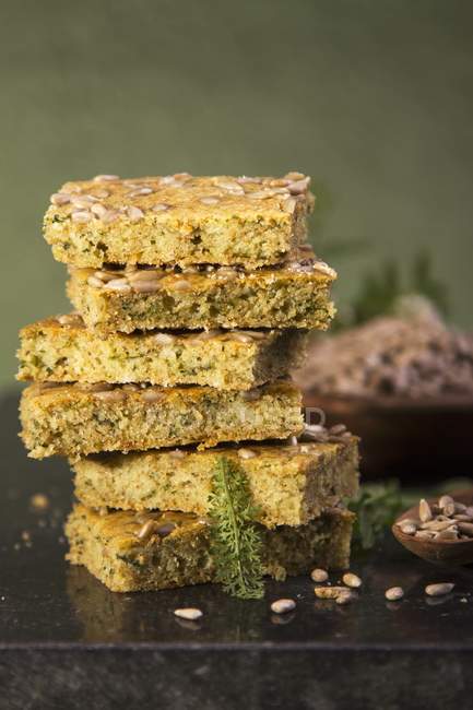 Stacked slices of herb bread — Stock Photo