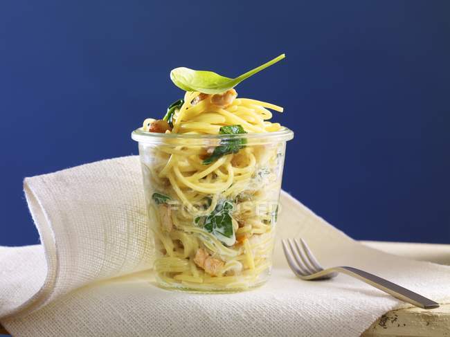 Spaghetti with spinach and salmon — Stock Photo