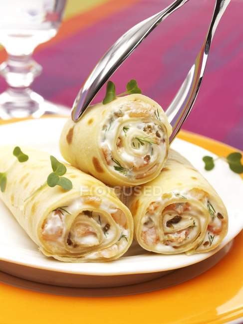 Rolled Shrimp crepes on plate — Stock Photo