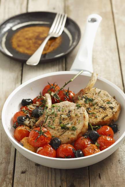 Pork chops with cherry tomatoes — Stock Photo