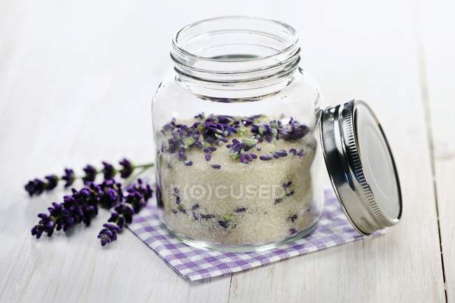 Closeup view of home-made lavender sugar in a screw top jar — Stock Photo