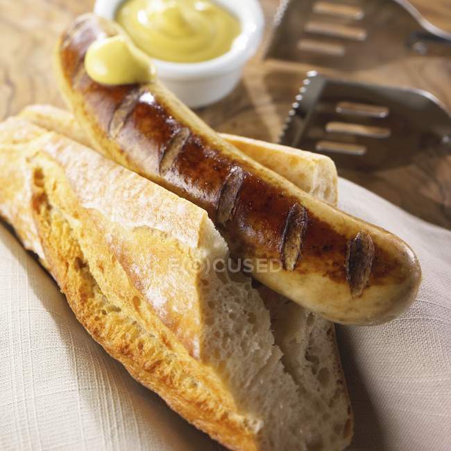 11165586.Grilled bratwurst with baguette — Stock Photo
