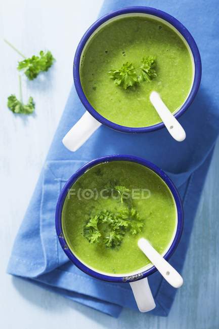 Pea soup garnished with parsley — Stock Photo