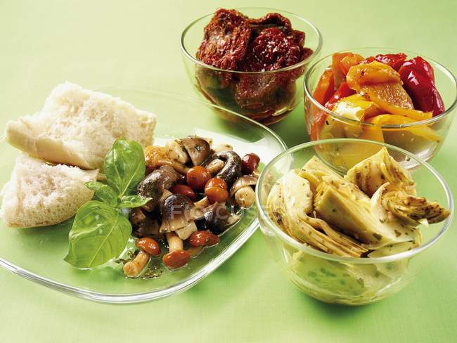 Italian appetizers on plates — Stock Photo