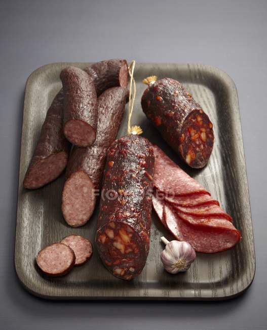 Smoked sausages and salamis — Stock Photo