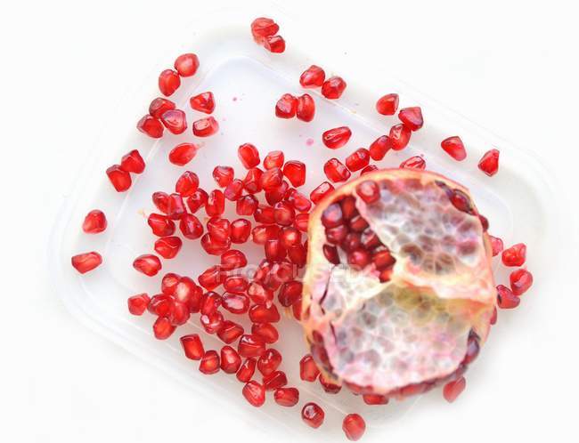 Sliced pomegranate with seeds — Stock Photo
