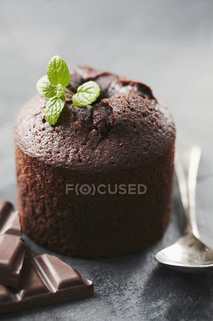Chocolate souffle with mint leaves — Stock Photo