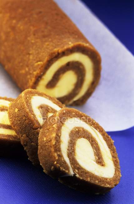 Closeup view of sliced coffee Swiss roll — Stock Photo