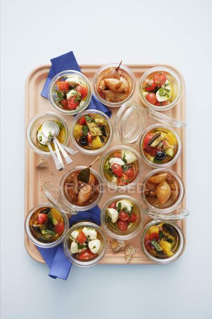 Top view of various appetizers in glasses on tray — Stock Photo